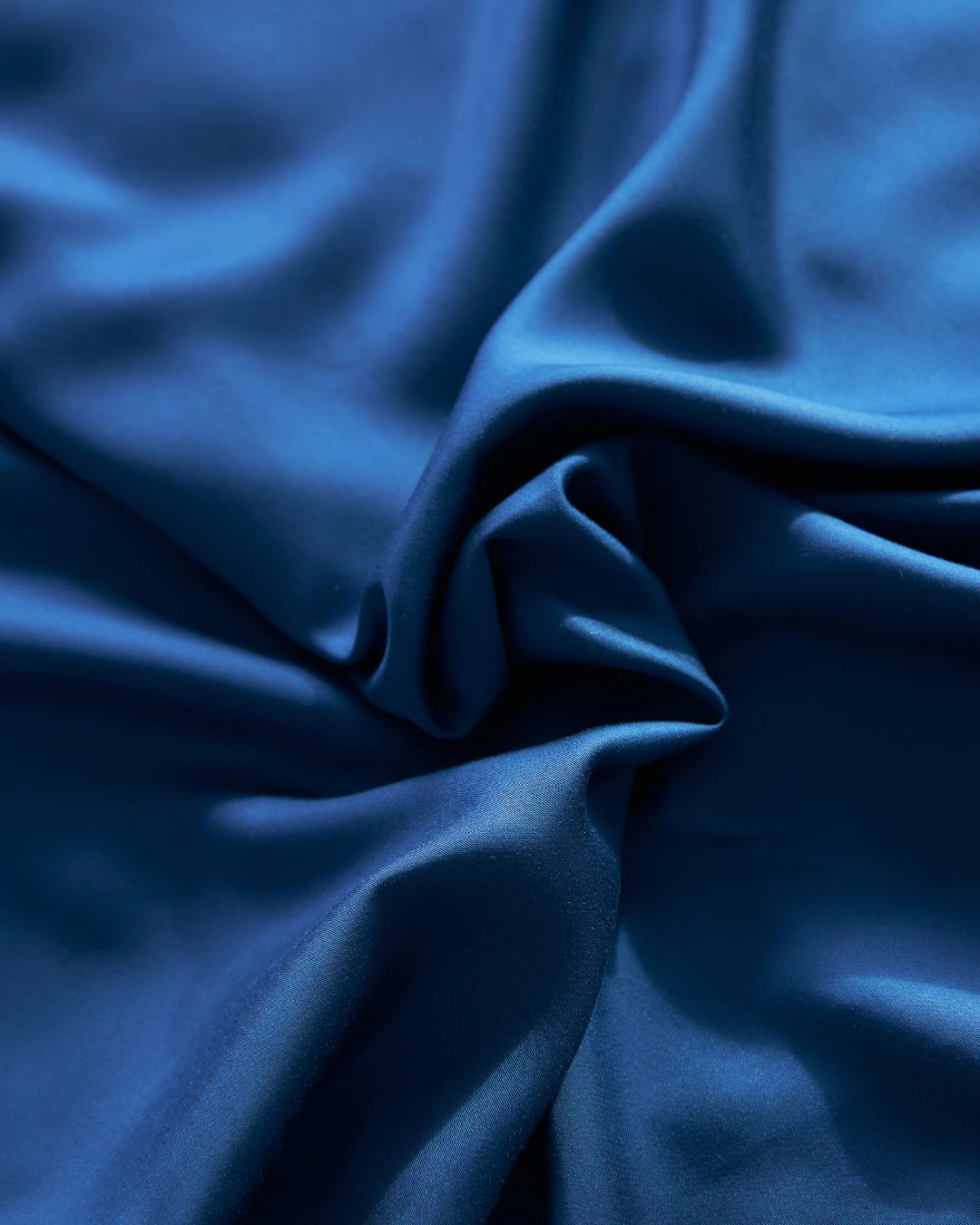 Close-up of blue fabric with folds