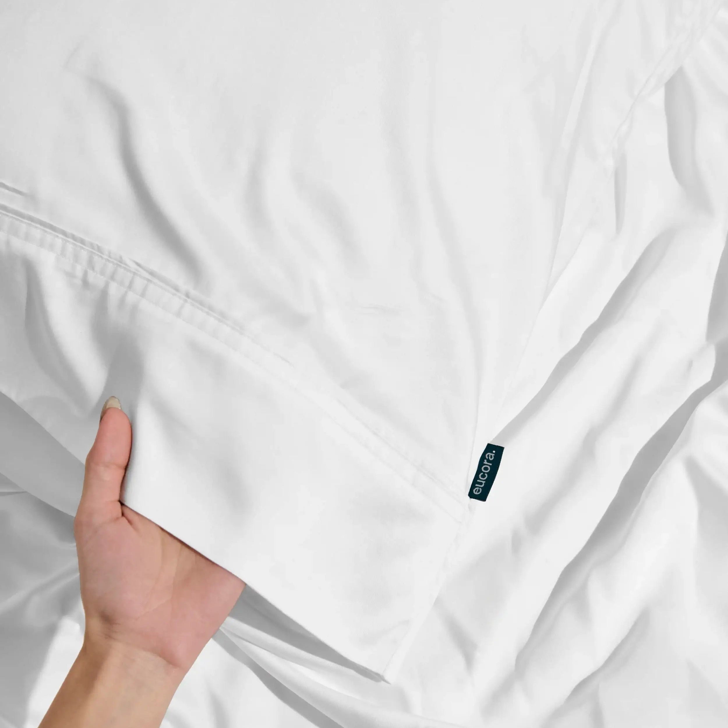 White shirt with a brand logo on a white background