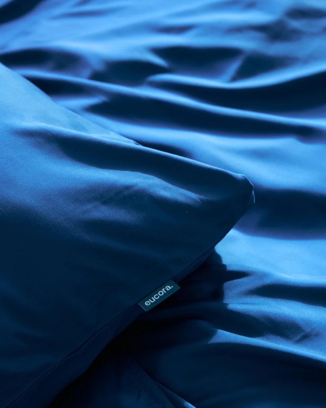Close-up of blue fabric with 'eucora' label